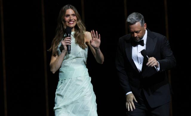 US Actress singer Mandy Moore and US comedian Nate Bargatze present the movie "The Breadwiner" onstage during the Sony Pictures Entertainment Presentation & Opening Night at CinemaCon at The Colosseum at Caesars Palace on April 13, 2026 in Las Vegas, Nevada. (Photo by VALERIE MACON / AFP)
