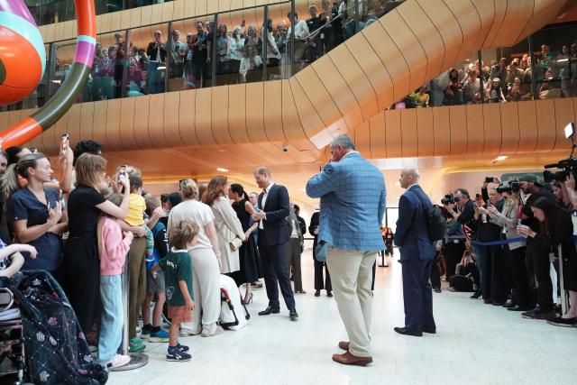 Britain's Prince Harry (C), Duke of Sussex, and his wife Meghan (centre L), the Duchess of Sussex, visit the Royal Children's Hospital in Melbourne on April 14, 2026. (Photo by Jonathan Brady / POOL / AFP)