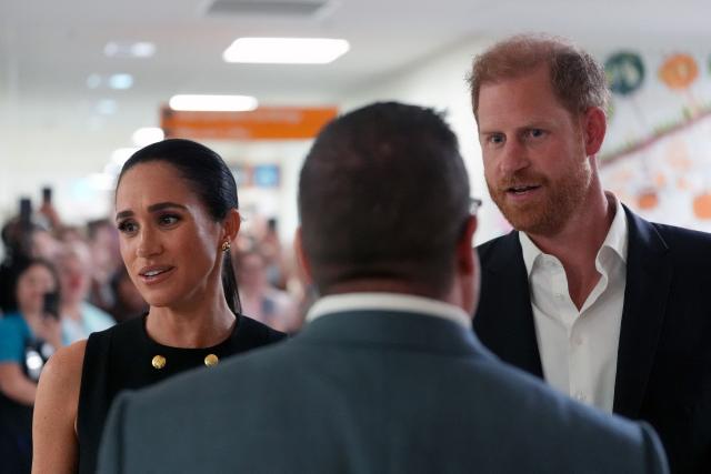 Britain's Prince Harry (R), Duke of Sussex, and his wife Meghan (L), the Duchess of Sussex, visit the Royal Children's Hospital in Melbourne on April 14, 2026. (Photo by Jonathan Brady / POOL / AFP)