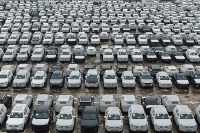 This aerial photo shows Volvo vehicles awaiting export at the port in Nanjing, in China’s eastern Jiangsu province on April 14, 2026. (Photo by CN-STR / AFP) / China OUT
