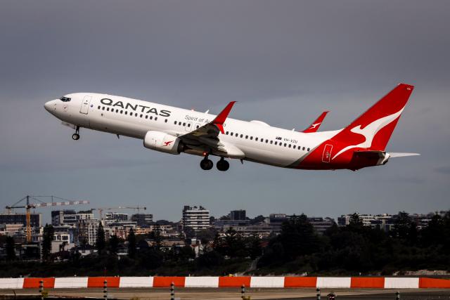 (FILES) A Qantas Airways Boeing 737 aircraft takes off from Sydney International Airport in Sydney on August 18, 2025. Surging jet fuel prices may raise costs for Australia's Qantas by up to Aus$800 million (US$570 million) in the second half of this year, the airline said April 14, 2026.
War in the Middle East has led jet fuel prices to more than double, and they remain "extremely volatile", the carrier said in a market update. (Photo by DAVID GRAY / AFP)