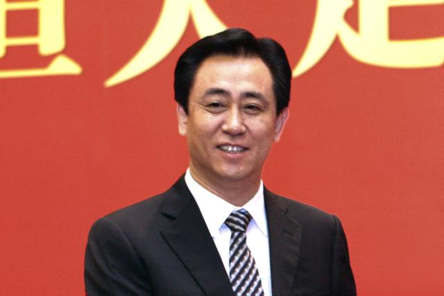 (FILES) Guangzhou Evergrande's chairman Xu Jiayin attends a football signing ceremony in Guangzhou, southern China's Guangdong province on May 17, 2012. Xu Jiayin, the founder of embattled Chinese property giant Evergrande has pleaded guilty to charges of fraud and bribery at trial, a Chinese court said on April 14, 2026. (Photo by AFP) / - China OUT