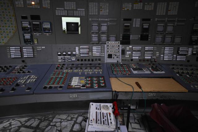 This photograph taken on April 9, 2026, shows a panel in the control room of the no longer working reactor 3 of the Chornobyl Nuclear Power Plant, amid the Russian invasion of Ukraine. An uncontrolled collapse of the internal radiation shell at the defunct Chernobyl nuclear power station in Ukraine could increase the risk of radioactivity release in the environment, Greenpeace warned on April 14, 2026. (Photo by Genya SAVILOV / AFP)