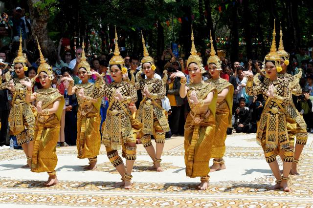 Dancers perform during Khmer New Year (Nokor Sankranta) celebrations at Wat Phnom in Phnom Penh on April 14, 2026. (Photo by TANG CHHIN Sothy / AFP)