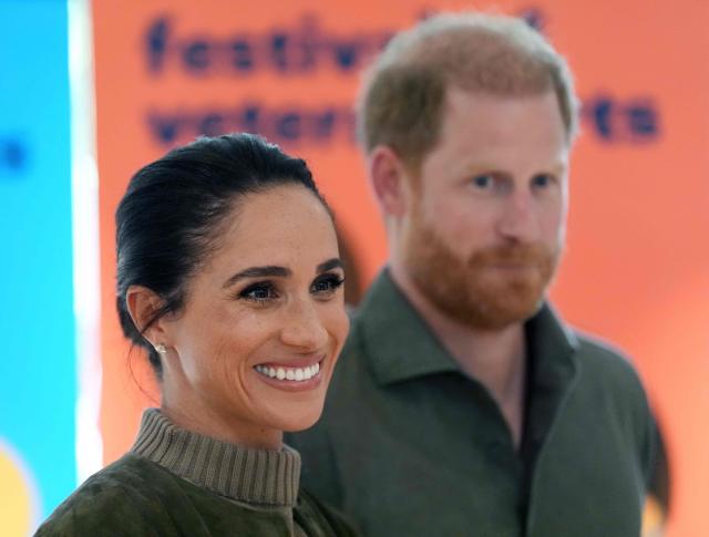 Britain's Prince Harry (R), Duke of Sussex, and his wife Meghan (L), the Duchess of Sussex, arrive at the Australian National Veterans Arts Museum (ANVAM) in Melbourne on April 14, 2026. (Photo by Jonathan Brady / POOL / AFP)