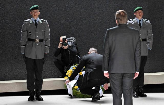 German Defence Minister Boris Pistorius (2nd R) looks on as his Ukrainian counterpart Mykhailo Fedorov (3rd R) lays a wreath at the memorial of the German armed forces Bundeswehr dedicated to the Bundeswehr members who lost their lives in the line of duty, at the German Defence Ministry in Berlin, on April 14, 2026. (Photo by RALF HIRSCHBERGER / AFP)