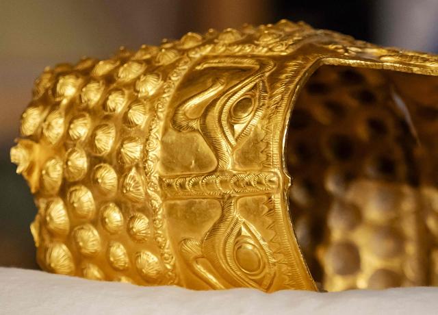 (FILES) This photograph shows a close-up view of the recovered golden helmet of Cotofenesti during its presentation to the press at the Drents Museum in Assen April 2, 2026. Three men went on trial on April 14, 2026 over the theft of a priceless gold Romanian helmet from a Dutch museum, a brazen heist that sparked shockwaves in Romania and the art world. (Photo by Sem van der Wal / ANP / AFP) / Netherlands OUT