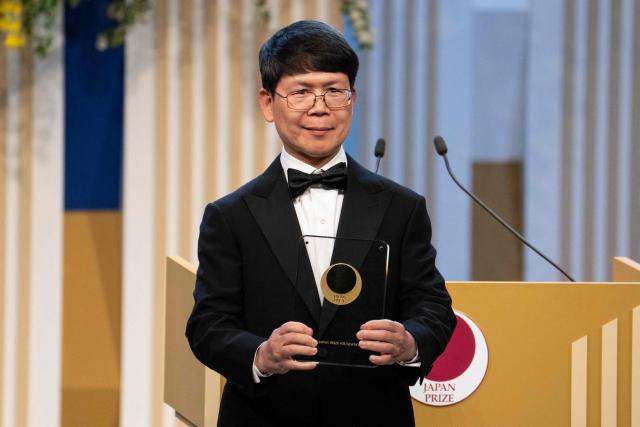 Chinese-American biochemist Zhijian Chen, winner of the Japan Prize in the field of Life Sciences, poses during the Japan Prize presentation ceremony in Tokyo on April 14, 2026. (Photo by Yuichi YAMAZAKI / AFP)