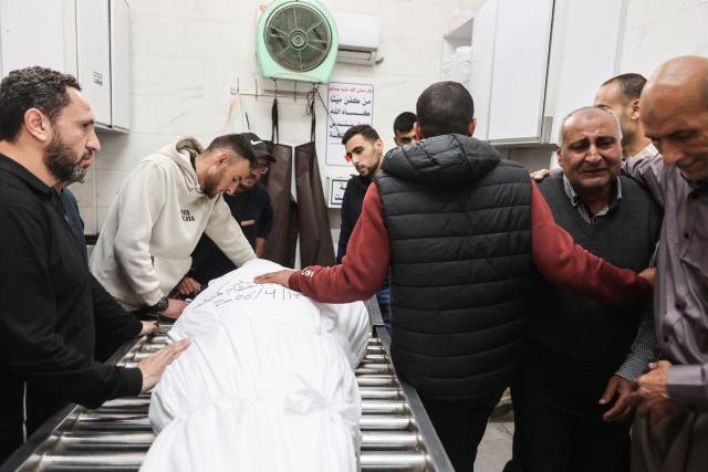 Palestinian mourners react during the funeral of Islam Quneita, a writer and managing editor for the website "Palestine Now", who according to medic was killed in an Israeli strike the day before, in Gaza City, on April 14, 2026. Gaza is still reeling from more than two years of war between Israel and Hamas, sparked by the militant group's October 7, 2023, attack on Israel. (Photo by Omar AL-QATTAA / AFP)