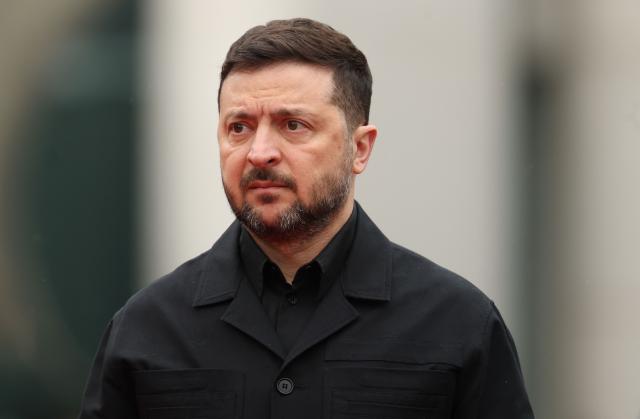 Ukrainian President Volodymyr Zelensky arrives for a visit at the Chancellery in Berlin on April 14, 2026 prior to German-Ukrainian government consultations. The meeting comes as US-initiated peace talks between Russia and Ukraine have stalled, with Kyiv baulking at the idea it could cede territory to Russia. (Photo by Odd ANDERSEN / AFP)