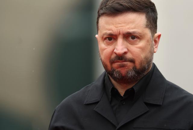 Ukrainian President Volodymyr Zelensky arrives for a visit at the Chancellery in Berlin on April 14, 2026 prior to German-Ukrainian government consultations. The meeting comes as US-initiated peace talks between Russia and Ukraine have stalled, with Kyiv baulking at the idea it could cede territory to Russia. (Photo by Odd ANDERSEN / AFP)