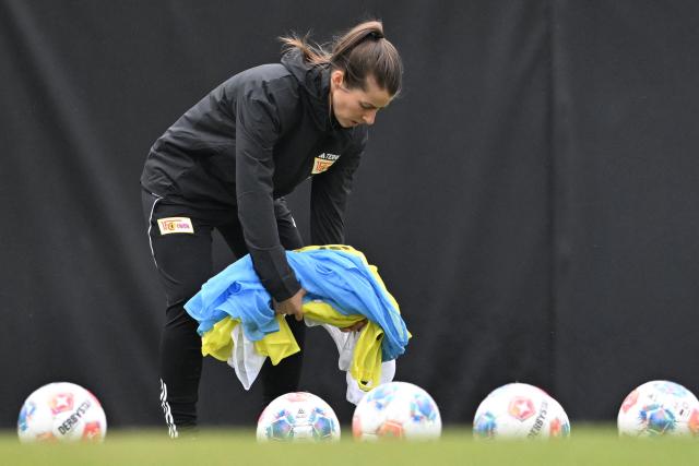 Union Berlin's new German head coach Marie-Louise Eta attends a training session of the  German first division Bundesliga football club 1 FC Union Berlin in Berlin on April 14, 2026. Bundesliga club Union Berlin named Marie-Louise Eta as head coach, making her the first female manager of a men's team in a top-five European league, after former mentor Steffen Baumgart was sacked. The 34-year-old will take over for the remainder of the season. (Photo by RALF HIRSCHBERGER / AFP)