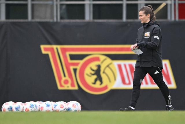 Union Berlin's new German head coach Marie-Louise Eta attends a training session of the  German first division Bundesliga football club 1 FC Union Berlin in Berlin on April 14, 2026. Bundesliga club Union Berlin named Marie-Louise Eta as head coach, making her the first female manager of a men's team in a top-five European league, after former mentor Steffen Baumgart was sacked. The 34-year-old will take over for the remainder of the season. (Photo by RALF HIRSCHBERGER / AFP)