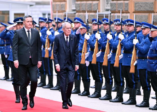 President of Austria Alexander Van der Bellen (R) and Chairman of the Presidency of Bosnia and Herzegovina Denis Becirovic (L) inspect a Bosnian honor guard, during a welcoming ceremony, in Sarajevo on April 14, 2026. President Van der Bellen arrived in a 2-day official visit to Bosnia and Herzegovina. (Photo by ELVIS BARUKCIC / AFP)