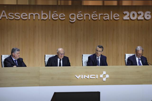 Vinci chief executive Xavier Huillard (2ndL) addresses shareholders next to Vinci chief executive Pierre Anjolras (2ndR) during the general meeting of infrastructure group Vinci in Paris on April 14, 2026. (Photo by Ludovic MARIN / AFP)