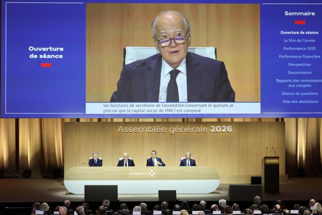 Vinci chief executive Xavier Huillard (C) addresses shareholders during the general meeting of infrastructure group Vinci in Paris on April 14, 2026. (Photo by Ludovic MARIN / AFP)