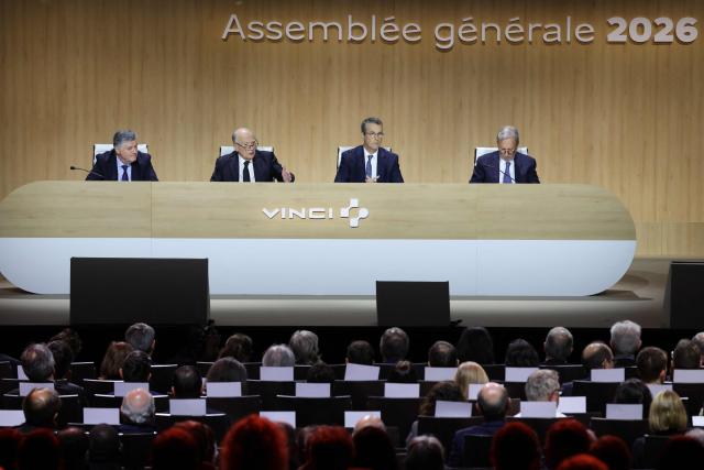 Vinci chief executive Xavier Huillard (2ndL) addresses shareholders next to Vinci chief executive Pierre Anjolras (2ndR) during the general meeting of infrastructure group Vinci in Paris on April 14, 2026. (Photo by Ludovic MARIN / AFP)
