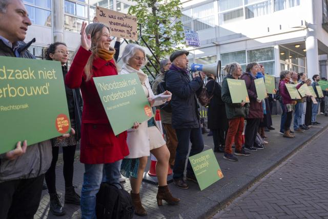 Protesters of 'The Stop the Asylum Laws' collective gather outside the Senate during a plenary session regarding the asylum laws in The Hague on April 14, 2026. (Photo by Jeroen Jumelet / ANP / AFP) / Netherlands OUT