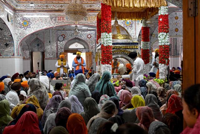 Sikh pilgrims gather to pay their respects on the occasion of the spring harvest festival 'Baisakhi' at the Gurdwara Panja Sahib in Hasan Abdal on April 14, 2026. (Photo by Aamir QURESHI / AFP)