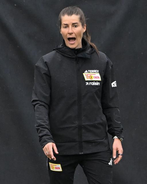 Union Berlin's new German head coach Marie-Louise Eta reacts during a training session of German first division Bundesliga football club 1 FC Union Berlin in Berlin on April 14, 2026. Bundesliga club Union Berlin named Marie-Louise Eta as head coach, making her the first female manager of a men's team in a top-five European league, after former mentor Steffen Baumgart was sacked. The 34-year-old will take over for the remainder of the season. (Photo by RALF HIRSCHBERGER / AFP)