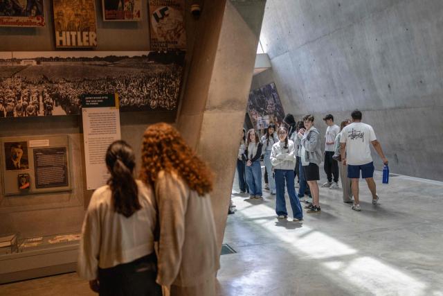 Israelis visit the Yad Vashem Holocaust Memorial Museum in Jerusalem during the annual Holocaust Remembrance Day on April 14, 2026. Israel came to a standstill on April 14, as sirens sounded across the country in tribute to the six million Jews murdered by the Nazis during World War II. This year's commemoration comes amid a fragile two-week ceasefire with Iran after a deadly war that began on February 28, when a joint US-Israeli air attack killed Iran's supreme leader (Photo by Ilia YEFIMOVICH / AFP)