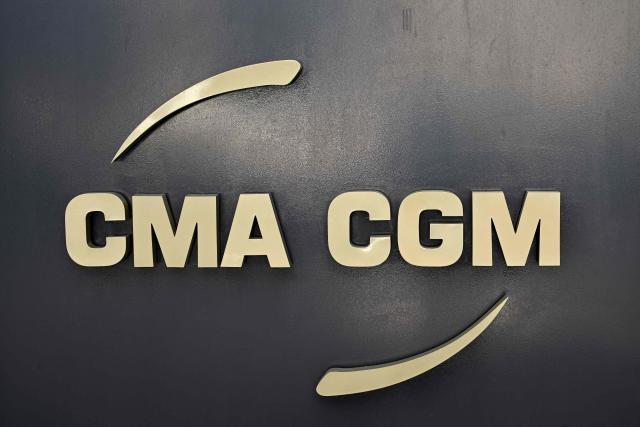 (FILES) A photograph taken on September 27, 2022 shows the logo of French container transportation and shipping company CMA CGM at the entrance of its headquarters in Marseille, southern France. The French company CMA CGM announced on Tuesday it was acquiring the Lebanese distribution and logistics group Fattal, a family-owned business employing several thousand people and operating across eight countries in the Middle East and North Africa, without disclosing the amount of the transaction. (Photo by Nicolas TUCAT / AFP)