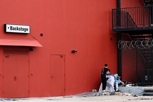 A man gets a haircut at an unofficial camp for displaced people in Beirut's waterfront area on April 14, 2026. Israel said it was open to peace with Lebanon ahead of the first direct talks in decades between the neighbours on April 14, but that Hezbollah remained the "problem" blocking an agreement on ending fighting. (Photo by Joseph EID / AFP)