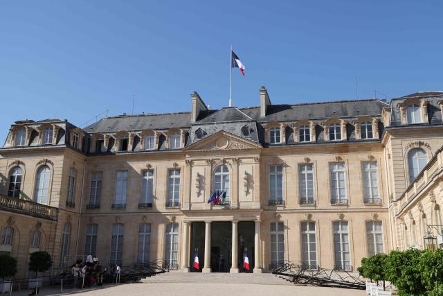 (FILES) The main entrance to the Elysee palace is pictured in Paris on July 1, 2025. Financial investigators raided the French presidential palace on April 14, 2026 as part of a probe into an events company repeatedly being awarded contracts to organise prestigious memorial ceremonies, a source with knowledge of the case said. (Photo by Ludovic MARIN / AFP)