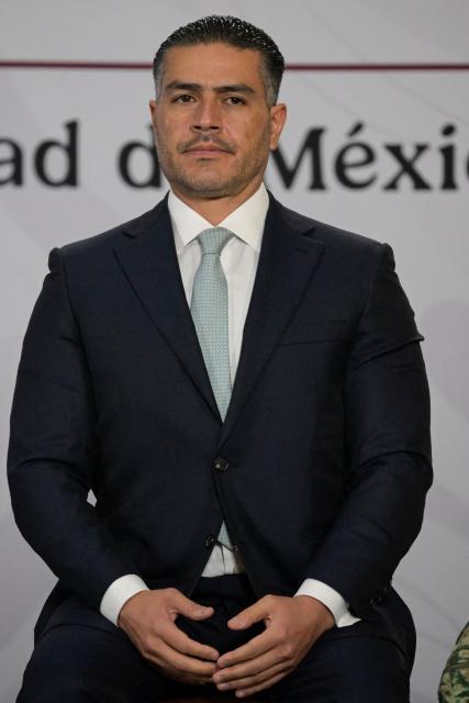 Mexican Secretary of Security and Citizen Protection, Omar Hamid Garcia Harfuch, is seen during Mexican president Claudia Sheinbaum's morning presser in Mexico City, on April 14, 2026. (Photo by Alfredo ESTRELLA / AFP)