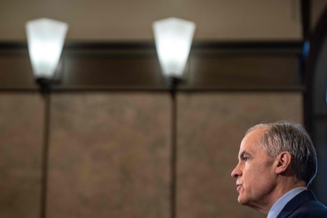 Canadian Prime Minister Mark Carney speaks during a press conference at the West Block on Parliament Hill in Ottawa, Ontario, Canada, on April 14, 2026. Carney's Liberal party secured a majority in Canada's parliament on April 13 after winning all three by-election seats up for grabs, boosting his Liberals as they work to bolster a country shaken by threats from the United States. (Photo by ANDREJ IVANOV / AFP)