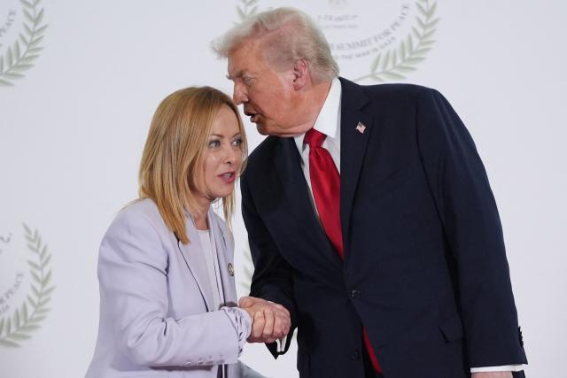 (FILES) US President Donald Trump greets Italy's Prime Minister Giorgia Meloni during a summit on Gaza in Sharm el-Sheikh on October 13, 2025. US President Donald Trump on April 14, 2026 launched a stinging criticism of Italy's Prime Minister Giorgia Meloni, one of his main European allies, over her unwillingness to join the Iran war. "I'm shocked at her. I thought she had courage, but I was wrong," he said in an interview with Italian daily Corriere della Sera. Meloni, Italy's far-right leader since October 2022, has been one of Trump's closest allies in Europe and often seeks to act as a mediator between diverging US and European views. (Photo by Evan Vucci / POOL / AFP)