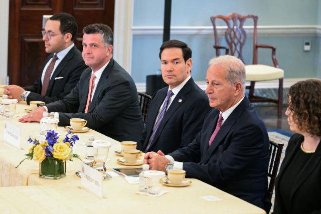 US Secretary of State Marco Rubio (C), alongside US State Department Counselor Michael Needham (2L) and US Ambassador to Lebanon Michel Issa (2R), looks on during a meeting with Lebanon's Ambassador to the US Nada Hamadeh Moawad (out of frame) and Israeli Ambassador to the US Yechiel Leiter (out of frame) at the State Department in Washington, DC, on April 14, 2026. (Photo by Oliver Contreras / AFP)