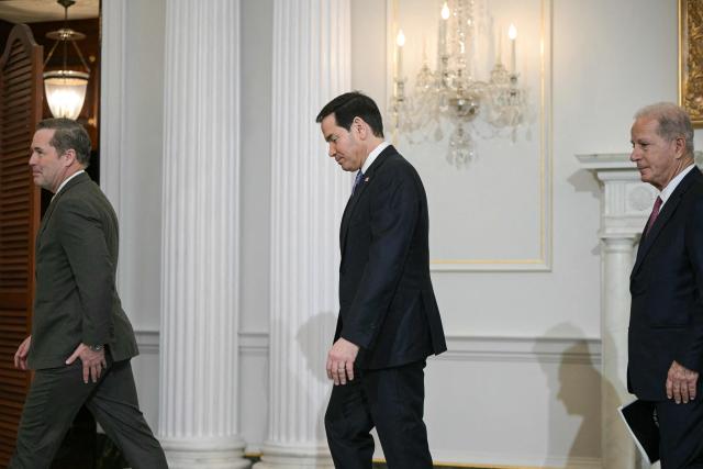 (L/R) US Ambassador to the UN Mike Waltz, US Secretary of State Marco Rubio, and US Ambassador to Lebanon Michel Issa, walk to a meeting with Lebanon's Ambassador to the US Nada Hamadeh Moawad (out of frame) and Israeli Ambassador to the US Yechiel Leiter (out of frame) at the State Department in Washington, DC, on April 14, 2026. (Photo by Oliver Contreras / AFP)