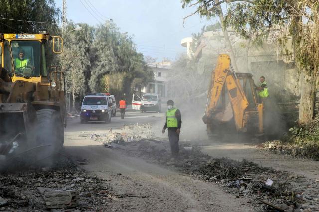 First responders gather at the site of an Israeli airstrike that targeted the southern Lebanese village of Srifa on April 14, 2026. Israel's Foreign Minister Gideon Saar said his country is seeking "peace and normalisation" with Lebanon, ahead of talks between officials from both nations in Washington on April 14. Lebanon was pulled into the Middle East war after Hezbollah attacked Israel, sparking an Israeli ground invasion and airstrikes -- including an extremely heavy attack on Beirut on April 8. (Photo by Kawnat HAJU / AFP)