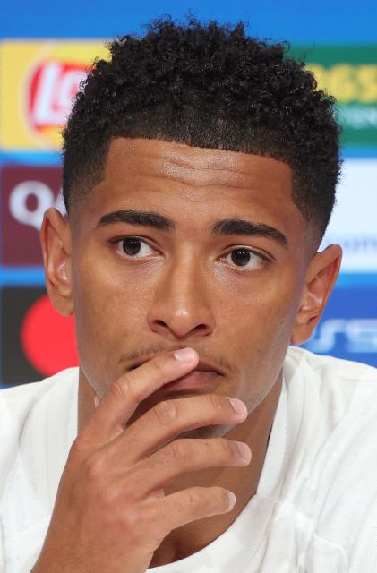 Real Madrid's English midfielder #05 Jude Bellingham addresses a press conference on April 14, 2026 in Munich, southern Germany, on the eve of the UEFA Champions League quarter-final second leg football match between FC Bayern Munich and Real Madrid. (Photo by Karl-Josef HILDENBRAND / AFP)