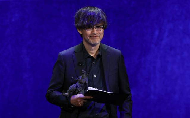 Japanese director Takashi Yamazaki presents the movie "Godzilla Minus Zero" during "The State of the Industry" and NEON presentation at CinemaCon at The Colosseum at Caesars Palace in Las Vegas, Nevada, on April 14, 2026. (Photo by VALERIE MACON / AFP)