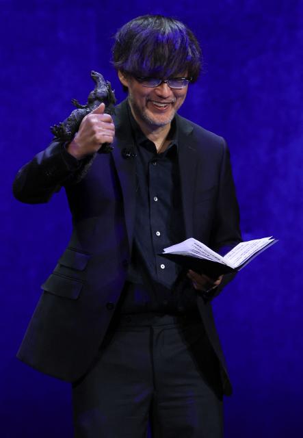 Japanese director Takashi Yamazaki presents the movie "Godzilla Minus Zero" during "The State of the Industry" and NEON presentation at CinemaCon at The Colosseum at Caesars Palace in Las Vegas, Nevada, on April 14, 2026. (Photo by VALERIE MACON / AFP)