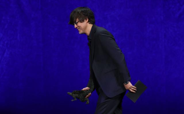 Japanese director Takashi Yamazaki presents the movie "Godzilla Minus Zero" during "The State of the Industry" and NEON presentation at CinemaCon at The Colosseum at Caesars Palace in Las Vegas, Nevada, on April 14, 2026. (Photo by VALERIE MACON / AFP)