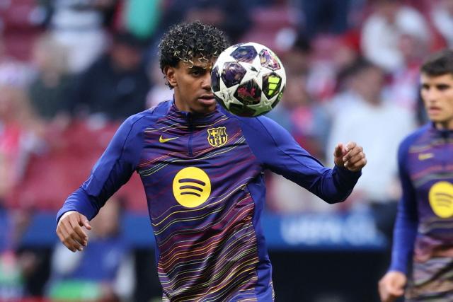 Barcelona's Spanish forward #10 Lamine Yamal warms up before the UEFA Champions League quarter final second leg football match between Club Atletico de Madrid and FC Barcelona at Metropolitano Stadium in Madrid on April 14, 2026. (Photo by Thomas COEX / AFP)