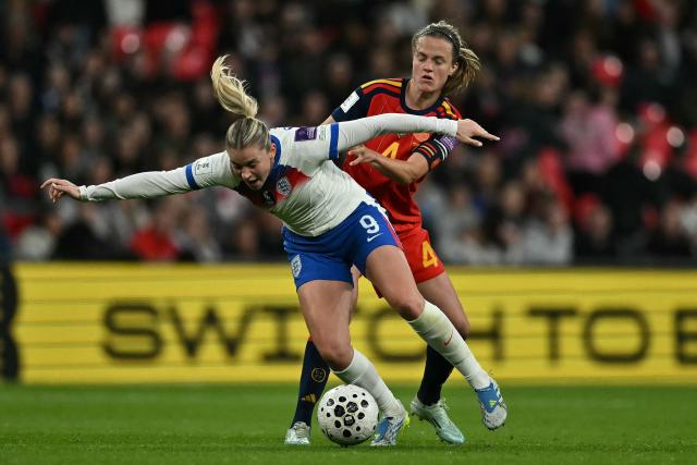 Spain's defender #04 Irene Paredes (R) fouls England's striker #09 Alessia Russo (L) during the Women's FIFA world cup league A, group 3, qualifier football match between England and Spain at Wembley stadium, in London on April 14, 2026. (Photo by Ben STANSALL / AFP)