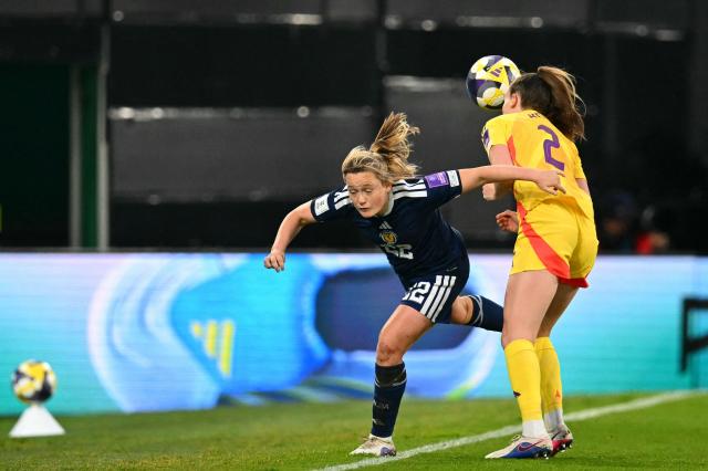 Scotland's Midfielder #22 Erin Cuthbert battles for the ball with Belgium's Defender #02 Sari Kees during the Women's FIFA world cup league B, group 4, qualifier football match between Scotland and Belgium at Easter Road, in Edinburgh, Scotland, on April 14, 2026. (Photo by ANDY BUCHANAN / AFP)