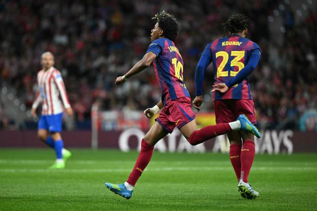 Barcelona's Spanish forward #10 Lamine Yamal celebrates scoring his team's first goal during the UEFA Champions League quarter final second leg football match between Club Atletico de Madrid and FC Barcelona at Metropolitano Stadium in Madrid on April 14, 2026. (Photo by Javier SORIANO / AFP)