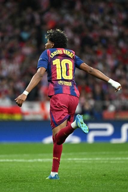 Barcelona's Spanish forward #10 Lamine Yamal celebrates scoring his team's first goal during the UEFA Champions League quarter final second leg football match between Club Atletico de Madrid and FC Barcelona at Metropolitano Stadium in Madrid on April 14, 2026. (Photo by Javier SORIANO / AFP)
