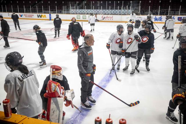 Canadian Prime Minister Mark Carney speaks with members of the Ottawa Charge women's professional hockey team at TD Place Arena in Ottawa, Canada on April 14, 2026. (Photo by ANDREJ IVANOV / AFP)