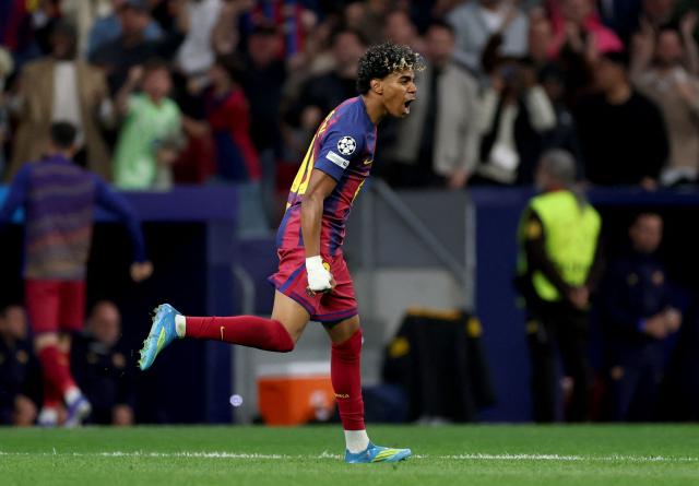 TOPSHOT - Barcelona's Spanish forward #10 Lamine Yamal celebrates scoring his team's first goal during the UEFA Champions League quarter final second leg football match between Club Atletico de Madrid and FC Barcelona at Metropolitano Stadium in Madrid on April 14, 2026. (Photo by Oscar DEL POZO / AFP)