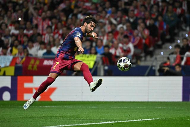 Barcelona's Spanish forward #07 Ferran Torres scores his team's second goal during the UEFA Champions League quarter final second leg football match between Club Atletico de Madrid and FC Barcelona at Metropolitano Stadium in Madrid on April 14, 2026. (Photo by Javier SORIANO / AFP)
