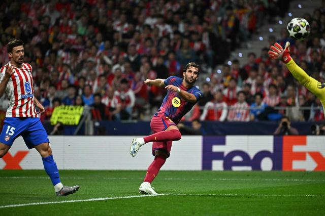 Barcelona's Spanish forward #07 Ferran Torres scores his team's second goal during the UEFA Champions League quarter final second leg football match between Club Atletico de Madrid and FC Barcelona at Metropolitano Stadium in Madrid on April 14, 2026. (Photo by Javier SORIANO / AFP)