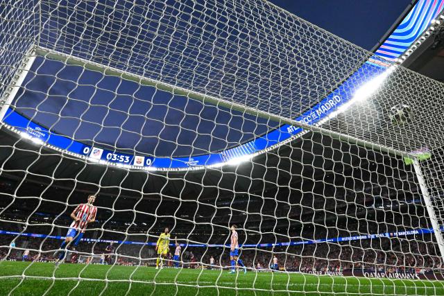 Barcelona's Spanish forward #10 Lamine Yamal (out of frame) scores his team's first goal during the UEFA Champions League quarter final second leg football match between Club Atletico de Madrid and FC Barcelona at Metropolitano Stadium in Madrid on April 14, 2026. (Photo by Javier SORIANO / AFP)