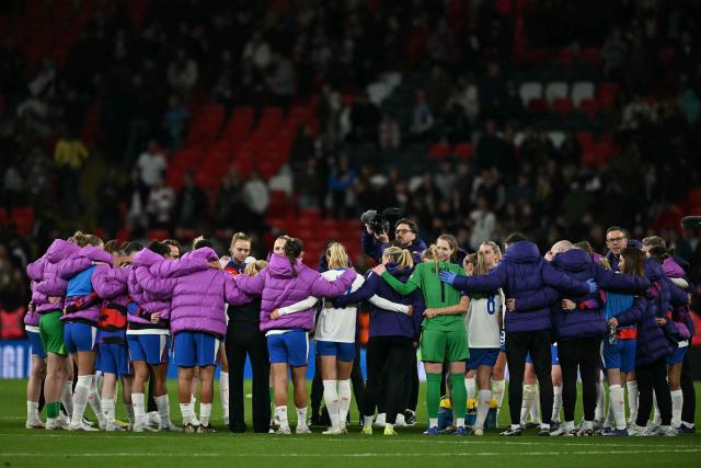 England's players have a huddle on the pitch after the Women's FIFA world cup league A, group 3, qualifier football match between England and Spain at Wembley stadium, in London on April 14, 2026. England won the game 1-0. (Photo by Ben STANSALL / AFP)