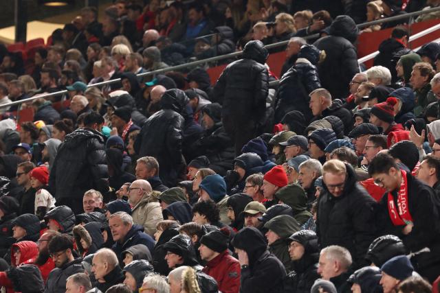 Fans depart during the UEFA Champions League quarter final, second-leg football match between Liverpool and Paris Saint-Germain at Anfield in Liverpool, north west England on April 14, 2026. (Photo by FRANCK FIFE / AFP)